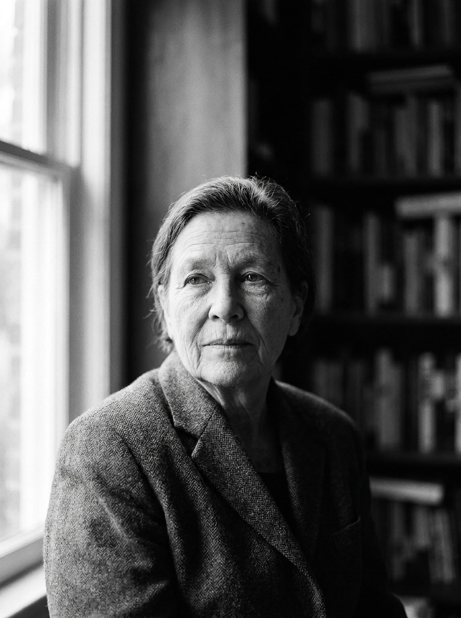 Black-and-white editorial portrait of a person looking calm and self-assured